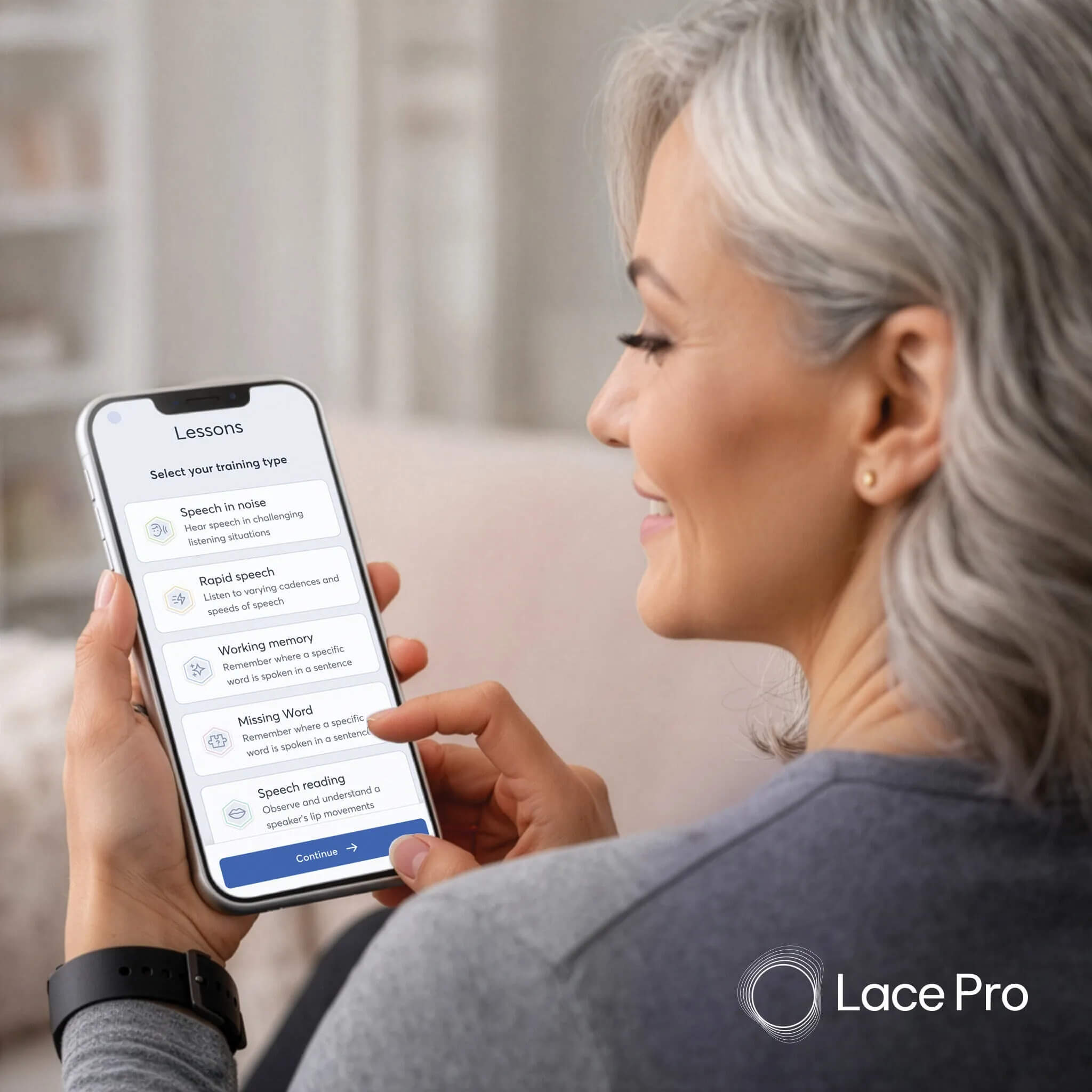 Woman selecting a LACE Pro auditory training lesson on her smartphone at home
